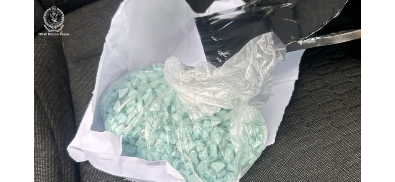 Suspected gang member arrested and charged with possession of drugs and cash found in vehicle.