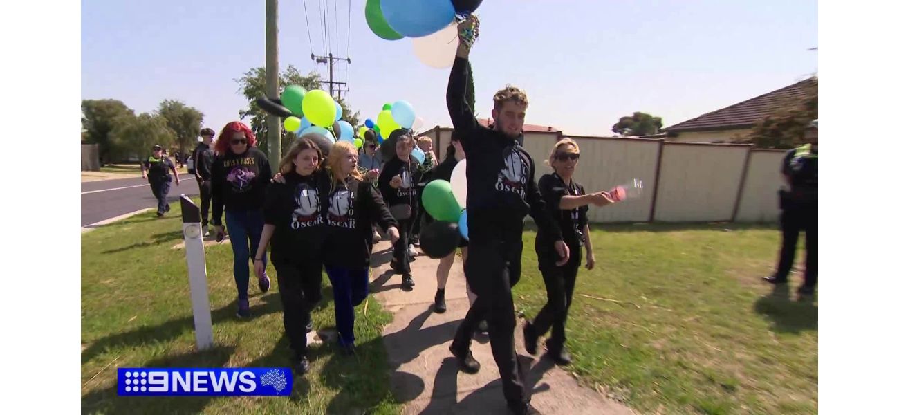 A large group of people walks through Melbourne's streets to pay tribute to a victim of knife crime.