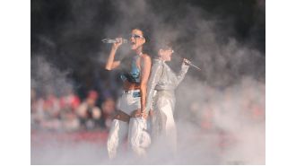 Australian singer joins Katy Perry on stage, prompting cheers from the crowd.