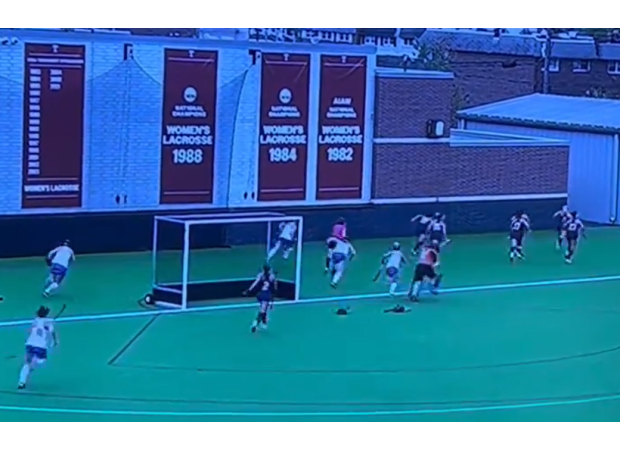 Gunfire at a hockey game causes chaos as players run for safety.