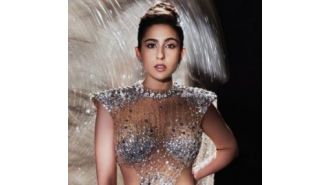 Sara Ali Khan looks gorgeous in a gold dress and stylish accessories.