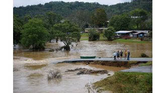 Expecting mother of two stuck in floodwaters.