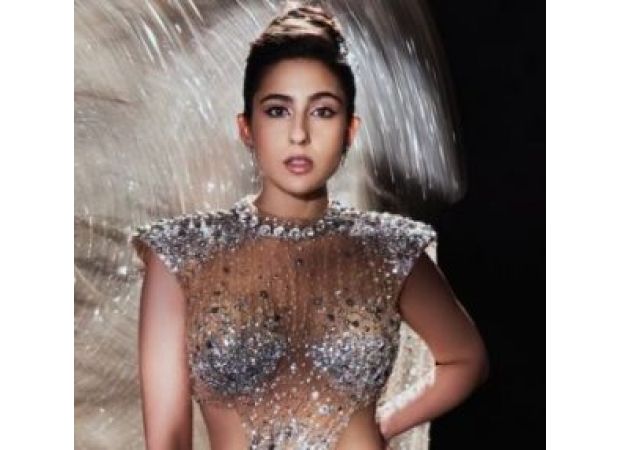 Sara Ali Khan looks gorgeous in a gold dress and stylish accessories.