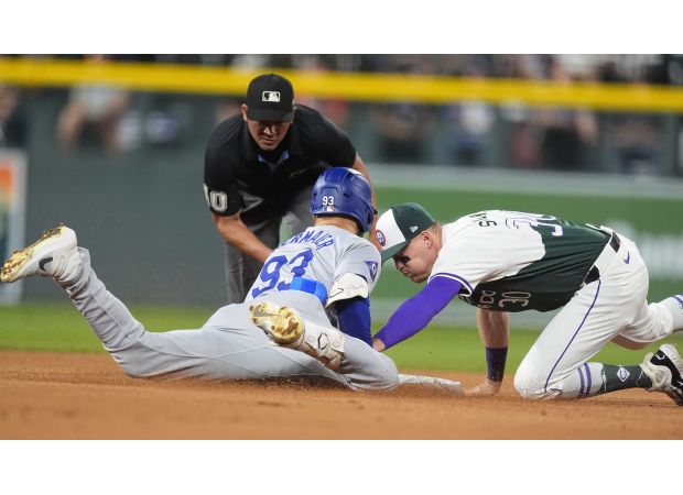 Rockies suffer another 100-loss season as Dodgers dominate.