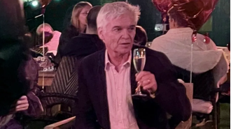 Phillip Schofield celebrates engagement with champagne as fans anticipate his TV return.