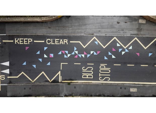 Confusion among parents due to bright road markings resembling Twister game.