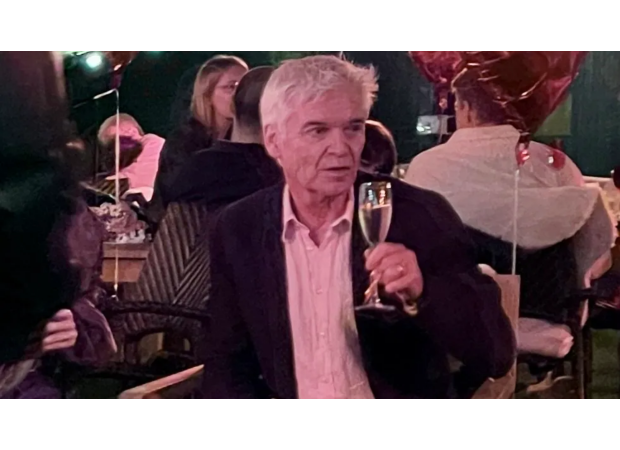 Phillip Schofield celebrates engagement with champagne as fans anticipate his TV return.