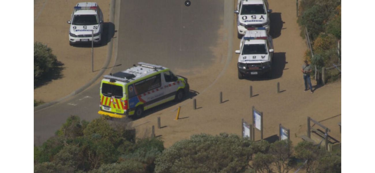 A woman has died after being swept off rocks with a group near Melbourne.