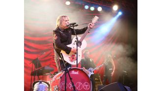 A rockstar from the 80s beat cancer and credits the NHS trial for their recovery, leading to the cancellation of their tour.