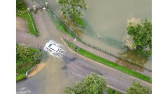 Rivers overflowing due to heavy rain; flood warnings still in effect.
