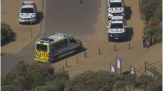 A woman has died after being swept off rocks with a group near Melbourne.