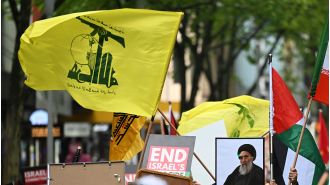 AFP says people waving Hezbollah flags can't be arrested for protesting.