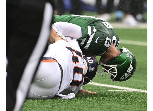 Justin Strnad has a standout game while keeping his loved ones in mind after Hurricane Helene's impact.