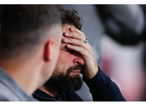 Bournemouth fans celebrate after learning that the last train to Southampton has been cancelled.