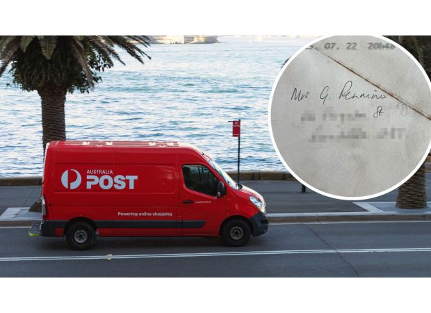 Woman perplexed by one detail on envelope.