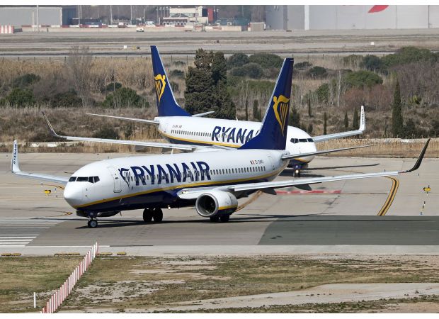 People leave plane due to flames on airport road