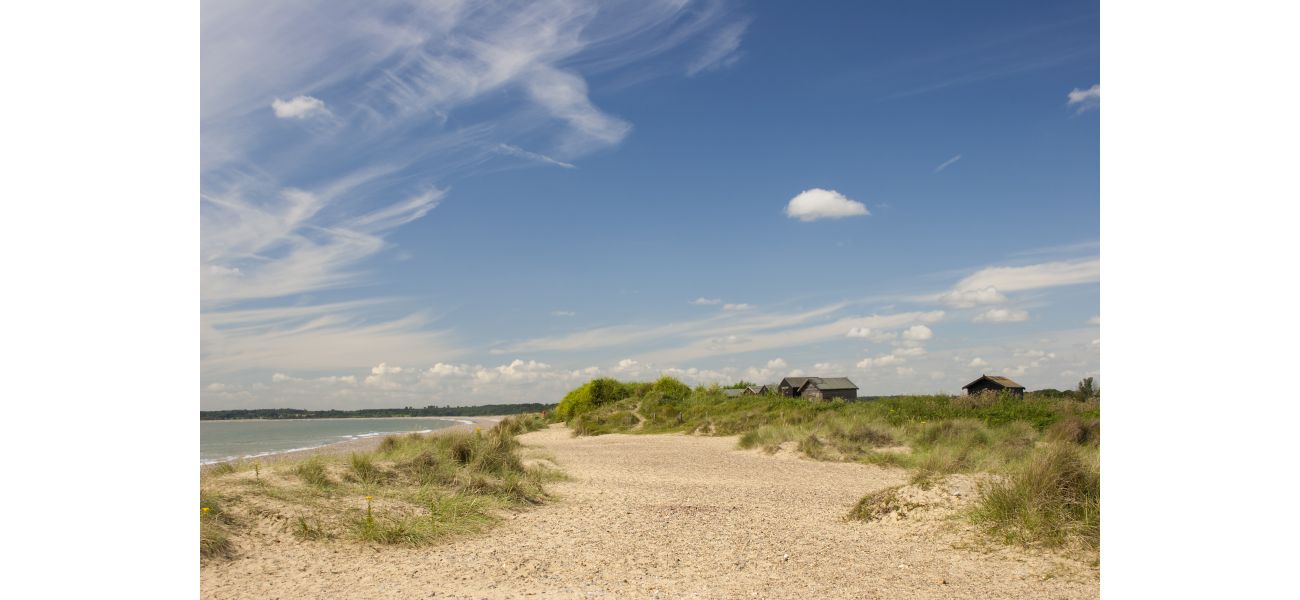 Charming town with serene beach recognized as one of UK's most upscale villages.