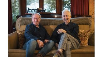 Alan Cumming praises the success of 'The Traitors' and encourages stepping outside of one's comfort zone.