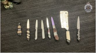 Queensland police arrest man and confiscate seven knives.
