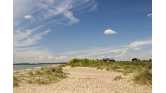 Charming town with serene beach recognized as one of UK's most upscale villages.