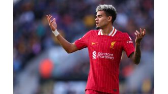Soccer coach Arne Slot discusses Liverpool's lineup changes and the absence of player Luis Diaz in their match against Crystal Palace.