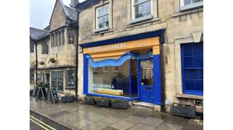Dry cleaner in trouble for damaging charm of UK town, must repaint store.