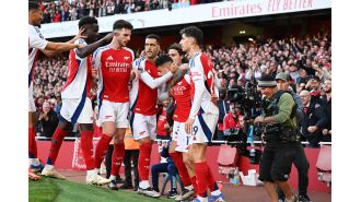 Gary Neville cautions Arsenal following close win over Southampton.