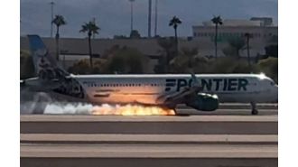 Plane lands in Las Vegas with visible flames.