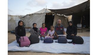 Following a family's journey through multiple moves across war-torn Gaza.