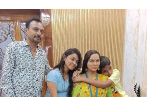 Family memorializes late relative with silicon statue displayed in home.