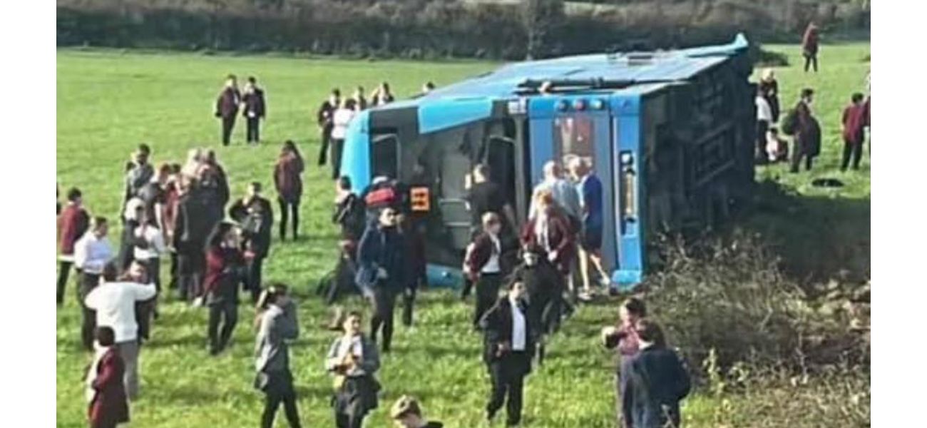 School bus flips over with many kids on board in serious accident.