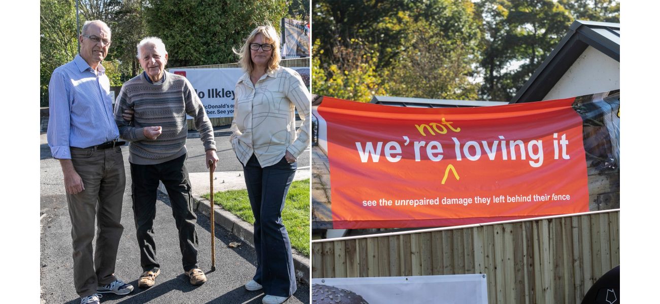 Woman expresses discontent with McDonald's by displaying banner near restaurant.
