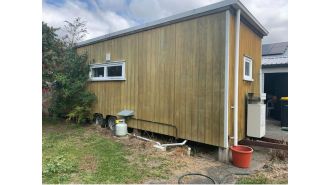 Police in New Zealand recover stolen tiny home.