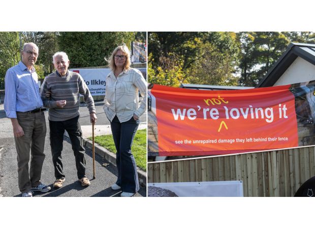 Woman expresses discontent with McDonald's by displaying banner near restaurant.