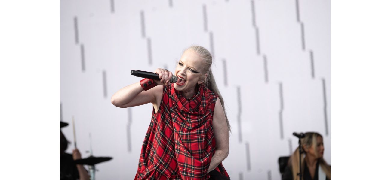 Shirley Manson, lead singer of Garbage, is seen in a hospital bed following a major surgery that has not been specified.