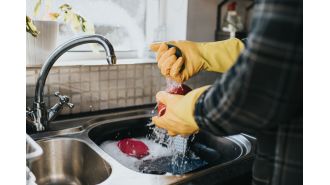 Soccer player required operation after injuring hand while washing dishes.