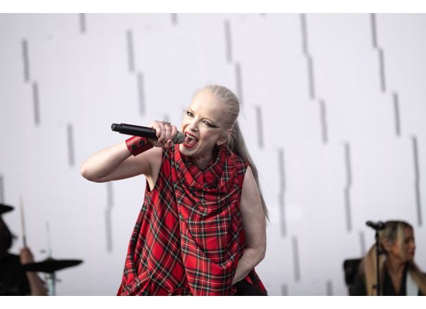 Shirley Manson, lead singer of Garbage, is seen in a hospital bed following a major surgery that has not been specified.