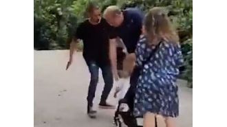 Man violently strikes baby in Barcelona incident.
