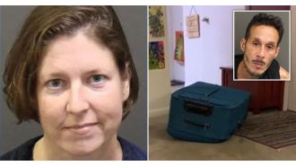 A woman was seen laughing while her boyfriend died after being trapped in a suitcase.