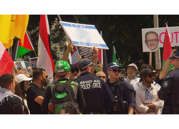 Australian restaurant owner facing charges for displaying a swastika at a protest supporting Palestine.