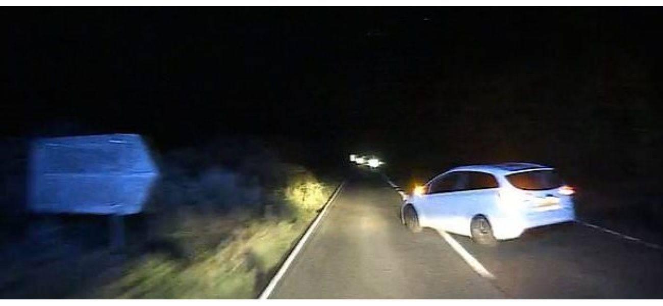 Police searching for driver who caused ambulance to overturn while en route to emergency.