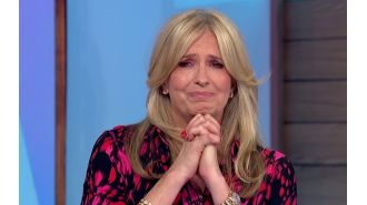 TV show host embraces fellow cast member Penny Lancaster after she cries on air.