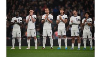 Why are England and Greece wearing black armbands at Wembley tonight?