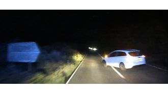Police searching for driver who caused ambulance to overturn while en route to emergency.