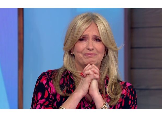 TV show host embraces fellow cast member Penny Lancaster after she cries on air.