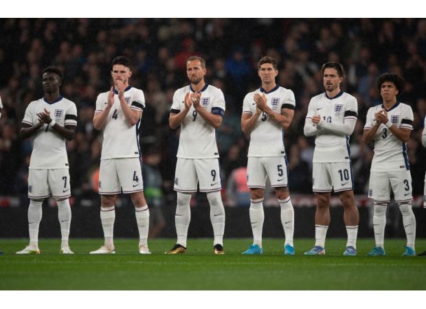 Why are England and Greece wearing black armbands at Wembley tonight?