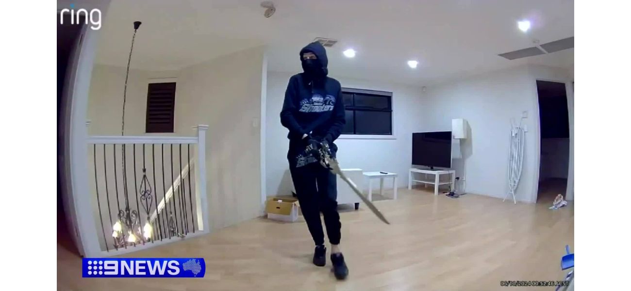 Scary home invasion caught on camera with man holding huge sword.