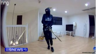 Scary home invasion caught on camera with man holding huge sword.