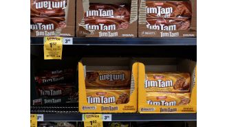 Major Australian supermarkets deny responsibility for expensive Tim Tams.