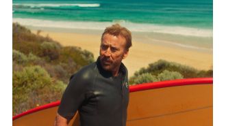 Nicolas Cage has a wild new catchphrase in his latest movie about a gangster who surfs.